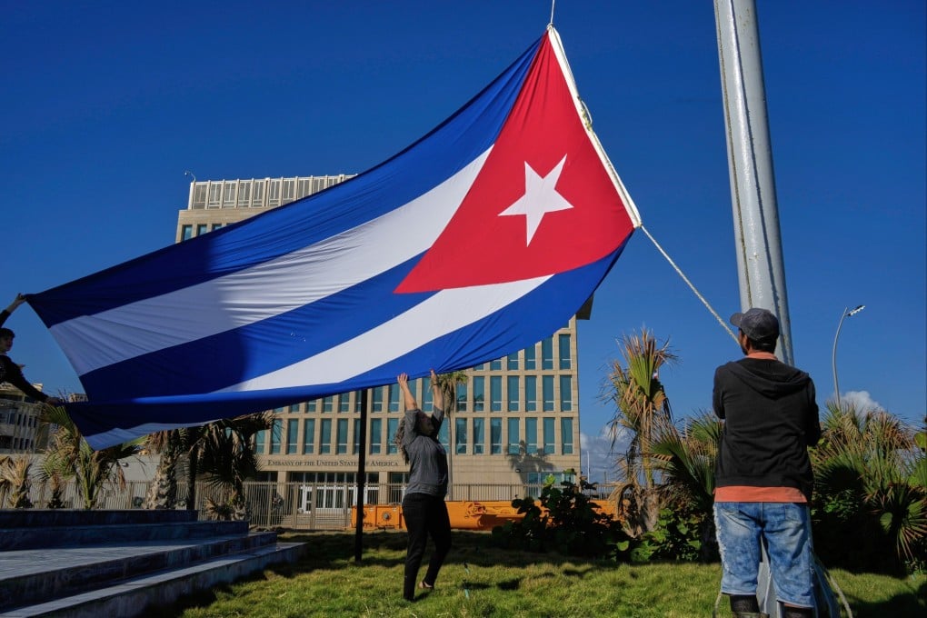 The Cuban flag near the US embassy in Havana. Cuba on Monday confirmed recent talks with US officials. Photo: AP
