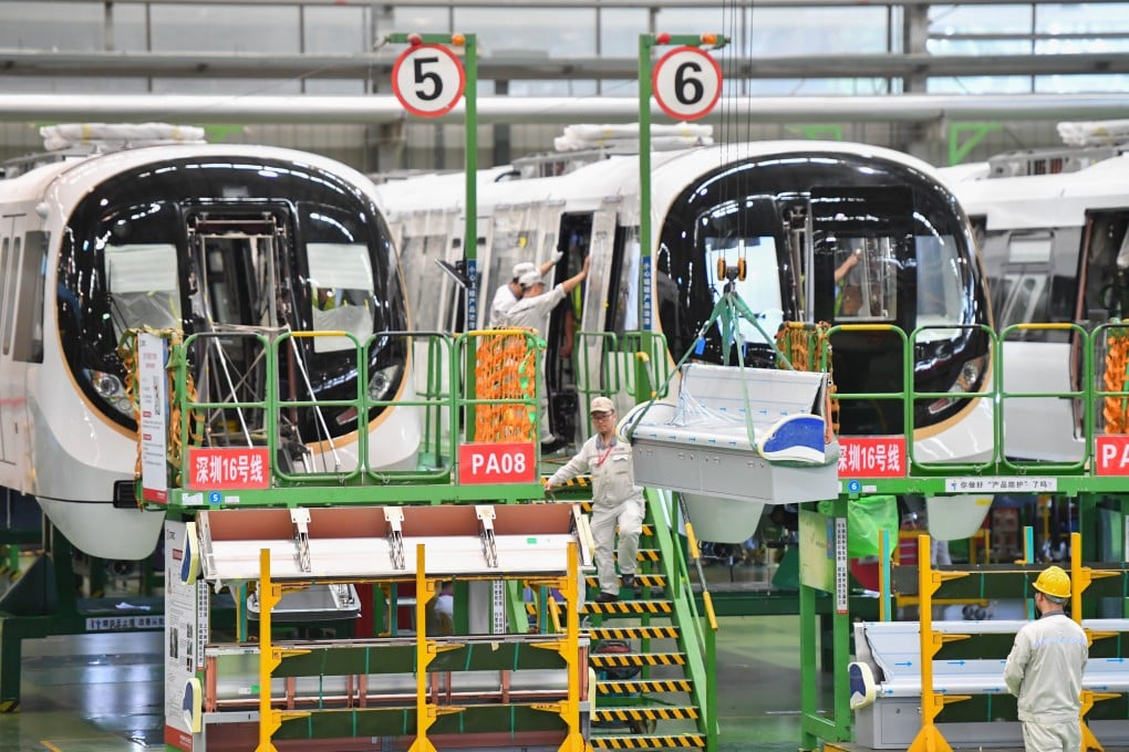 Workers operate on a production line at an assembly workshop of CRRC Zhuzhou Locomotive in China’s Hunan province. Photo: Xinhua