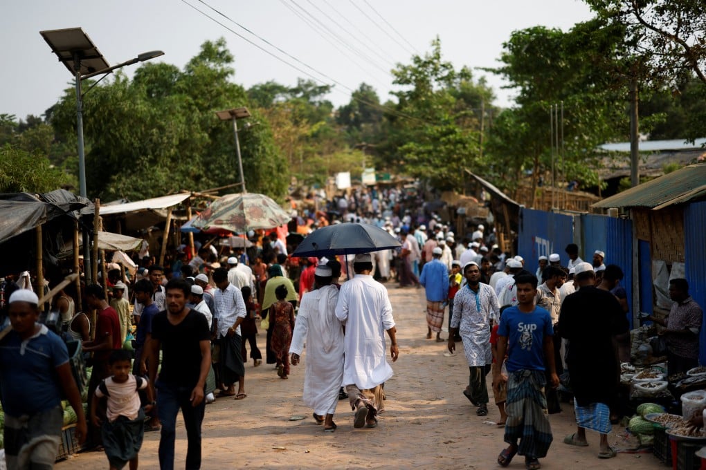 Rohingya refugees gather at a roadside market inside a refugee camp in Cox’s Bazar, Bangladesh, on Friday. Photo: Reuters