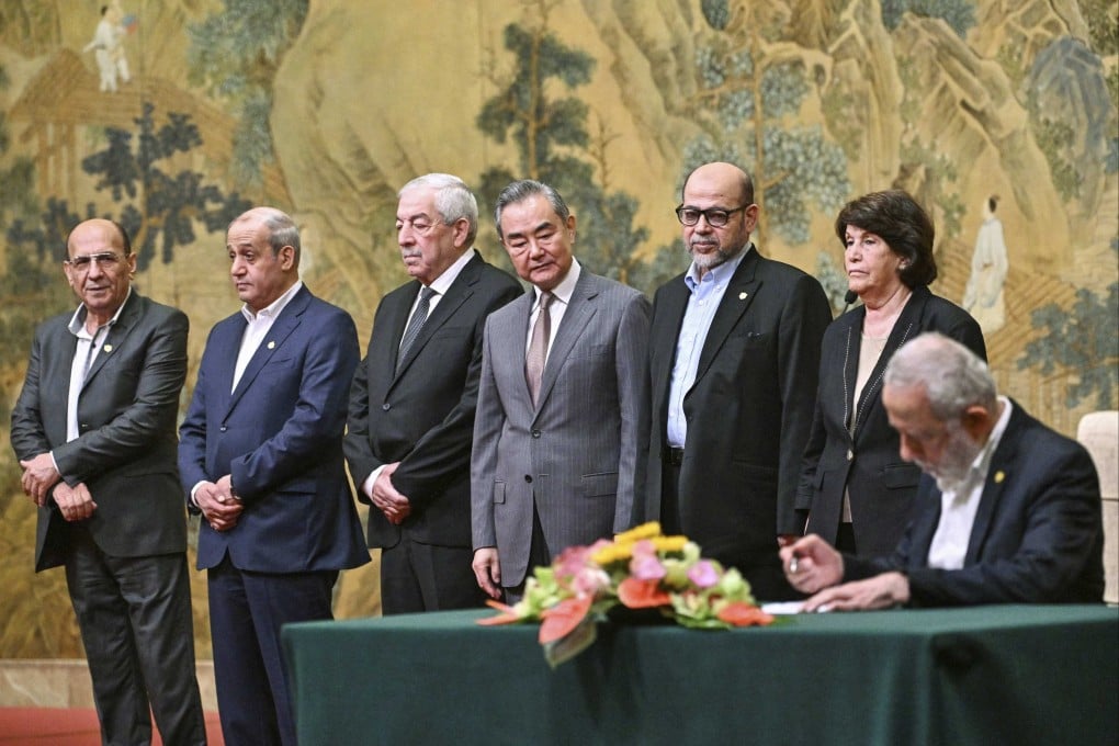 On July 23, 2024, China’s Foreign Minister Wang Yi hosts the signing of the Beijing Declaration among Palestinian factions including Fatah and Hamas at the Diaoyutai State Guesthouse in Beijing. Photo: Pool via AP