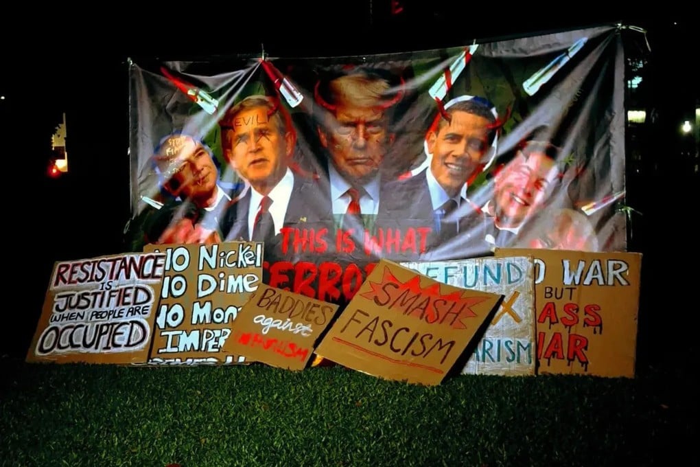 A banner at a protest in Singapore’s Hong Lim Park on Saturday shows past and present US presidents with horns on their heads. Photo: Instagram/sgacadboycott