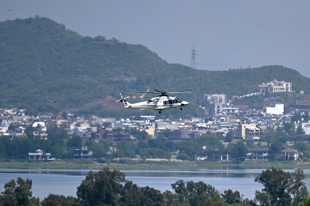 A helicopter flies over the Red Zone area in Islamabad, Pakistan on Monday amid heightened security measures ahead of anticipated US-Iran peace talks. Photo: AFP
