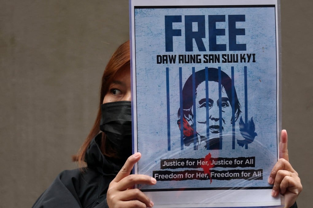 A protester from Myanmar living in Japan holds a placard showing detained former leader Aung San Suu Kyi during a rally in December outside Myanmar’s embassy in Tokyo denouncing the junta’s election. Photo: Reuters