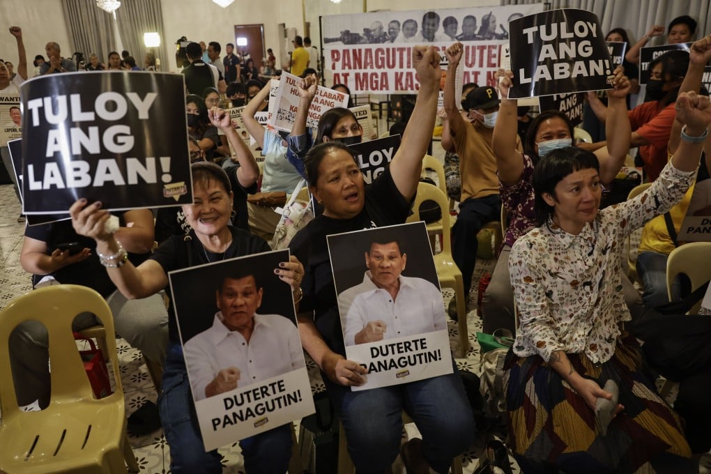 Relatives of victims of the deadly drug war campaign of ex-Philippine president Rodrigo Duterte react after watching a broadcast of the International Criminal Court at a gathering in Quezon City on Wednesday. Photo: EPA