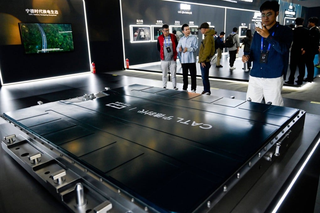 People look at a model of CATL’s Chocolate 26# Battery during the CATL Tech Day event ahead of the Beijing Auto Show in Beijing on April 21. Photo: AFP