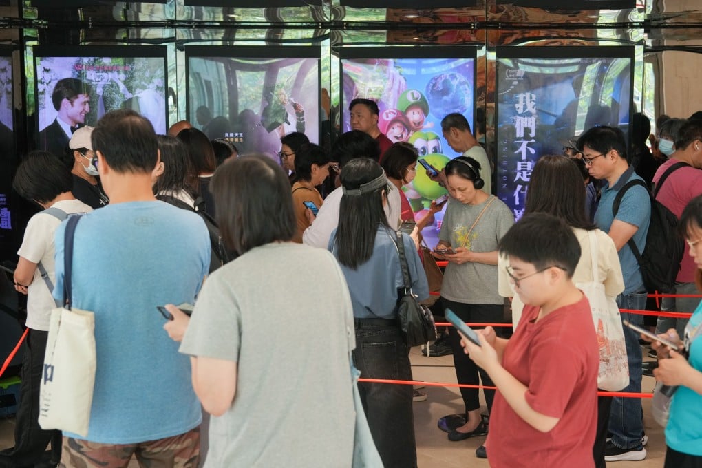 Customers queue at Star Cinema in Tseung Kwan O to buy HK$30 tickets on Wednesday. Photo: Sam Tsang