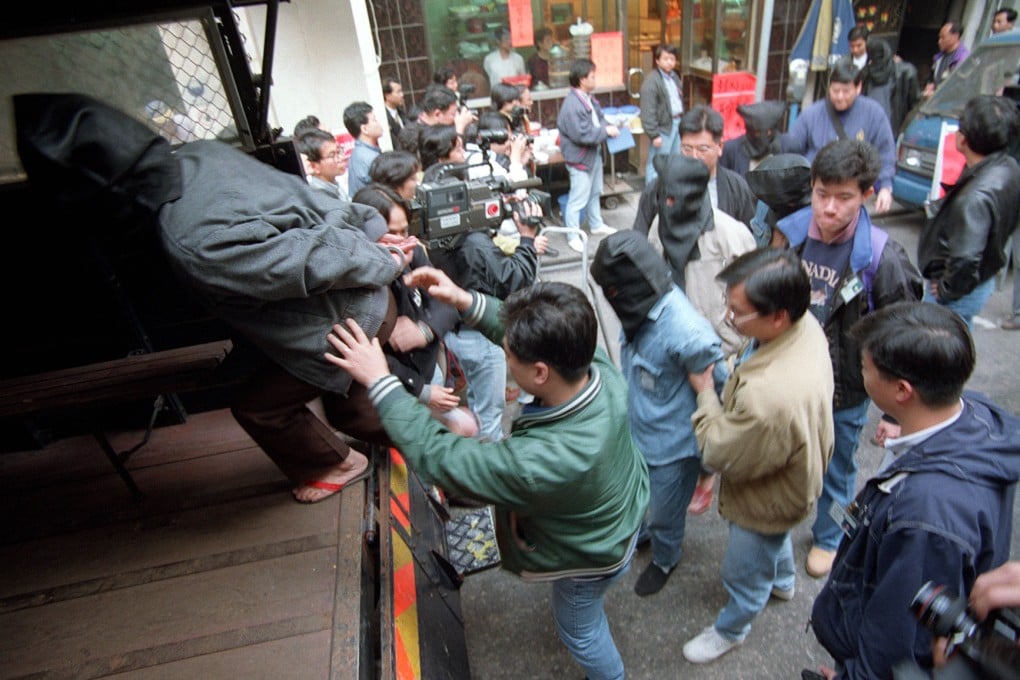Police arrest suspected 14K triad members at a restaurant in Tsim Sha Tsui, Hong Kong, in 1995. The 14K began life as an openly pro-Kuomintang society in mainland China before becoming a global criminal organisation based in Hong Kong. Photo: SCMP