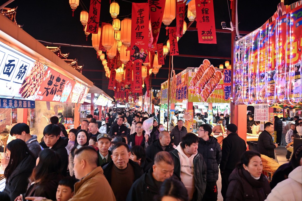 Tourists visit a food street in Xuanen county, Hubei province, during the Chinese New Year holiday in February. Photo: Xinhua