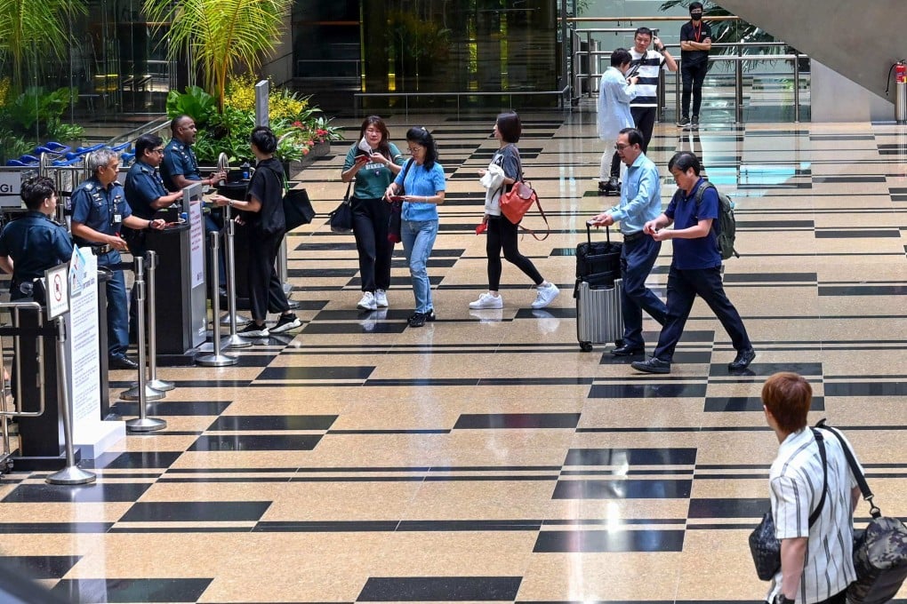 Passengers enter the departure area at Singapore’s Changi Airport. Photo: AFP