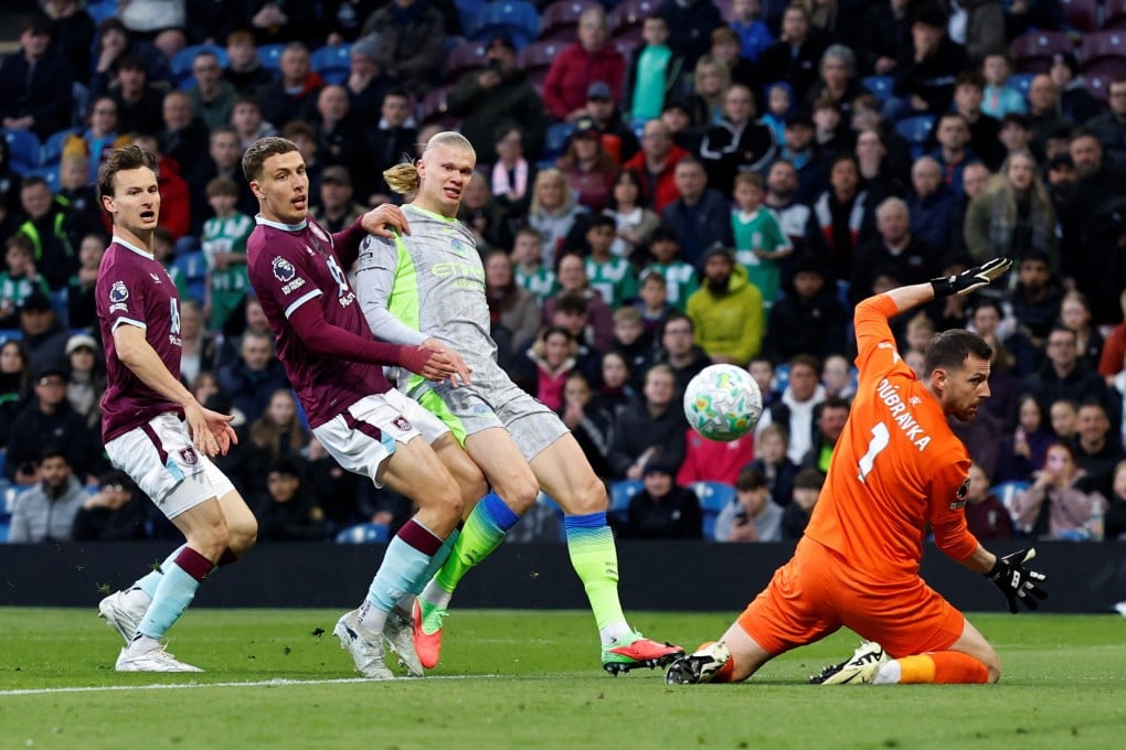 Erling Haaland (middle) scores Manchester City’s goal in their 1-0 win over Burnley on Wednesday to take them to the top of the table. Photo: Reuters
