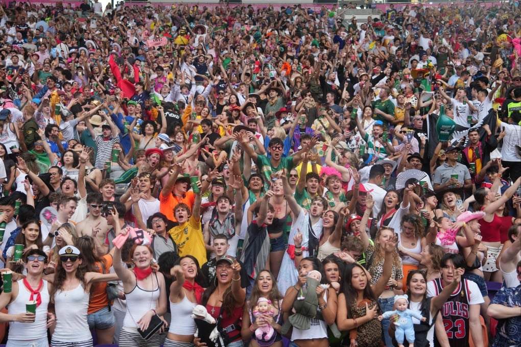 Rugby fans in the south stand celebrate on Day 3 of the Hong Kong Rugby Sevens at Kai Tak Stadium on April 19. Photo: Sam Tsang
