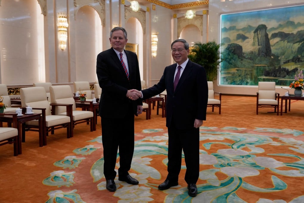 Chinese Premier Li Qiang greets US Senator Steve Daines ahead of their meeting at the Great Hall of the People in Beijing on March 23, 2025. Photo: Pool via Reuters