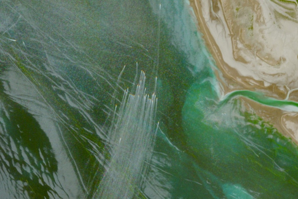 A satellite image shows a fleet of small boats at sea, north of the Strait of Hormuz near the Kargan coast, Iran. Photo: European Union/Copernicus Sentinel-2 via Reuters