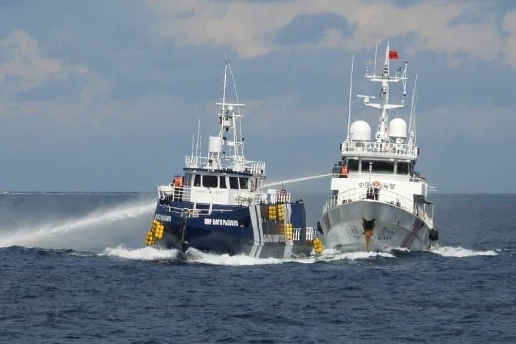 A Chinese coastguard vessel (right) fires its water cannon at the Philippine BRP Datu Pagbuaya near Philippines-occupied Thitu island, locally called Pag-asa island, at the South China Sea last October. Photo: Philippine coastguard via AP