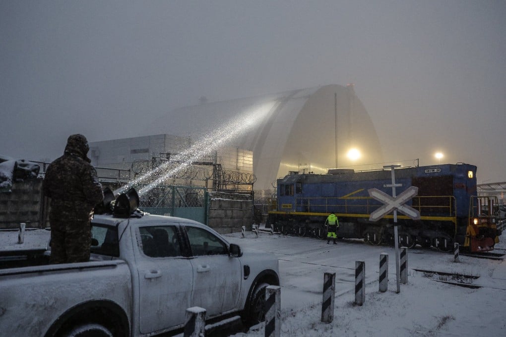 A Ukrainian serviceman directs a light on a damaged protective shelter over the remains of reactor Unit 4 at the Chernobyl nuclear power plant, near the city of Chernobyl, Ukraine in 2025. The Chernobyl nuclear disaster occurred on April 26, 1986. Photo: EPA