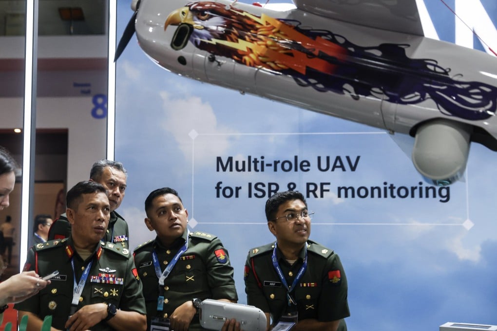 Malaysian army officers visit the booth of Special Technology Control, a Russian developer of unmanned systems, at the Defence Services Asia exhibition in Kuala Lumpur, Malaysia, on Tuesday. Photo: EPA