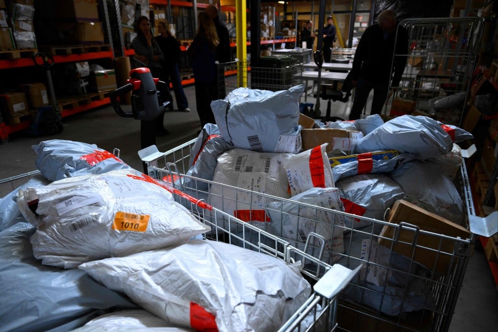 Customs agents at the airport of Bierset, Belgium, near Liege, control packages from China. Photo: AFP