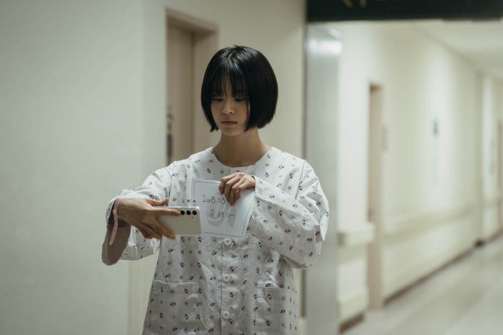 Jeon So-young as Yoo Se-ah in a still from If Wishes Could Kill, which offers high school horror with a chilling tech twist. Photo: Darae Lee/Netflix