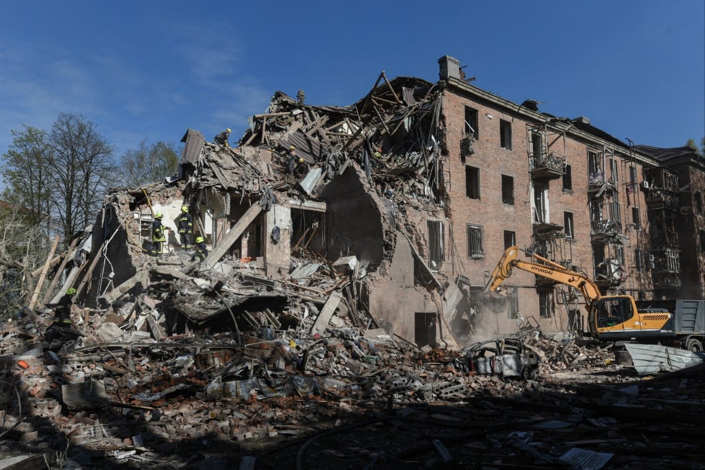 Rescue workers clear the rubble of a residential building destroyed by a Russian strike in Dnipro, Ukraine, on Saturday. Photo: AP