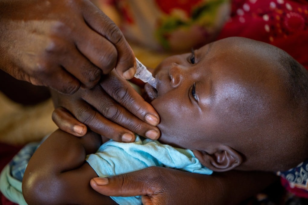 A child receives an oral Malaria vaccine in Lilongwe, Malawi. Photo: Unicef via Reuters