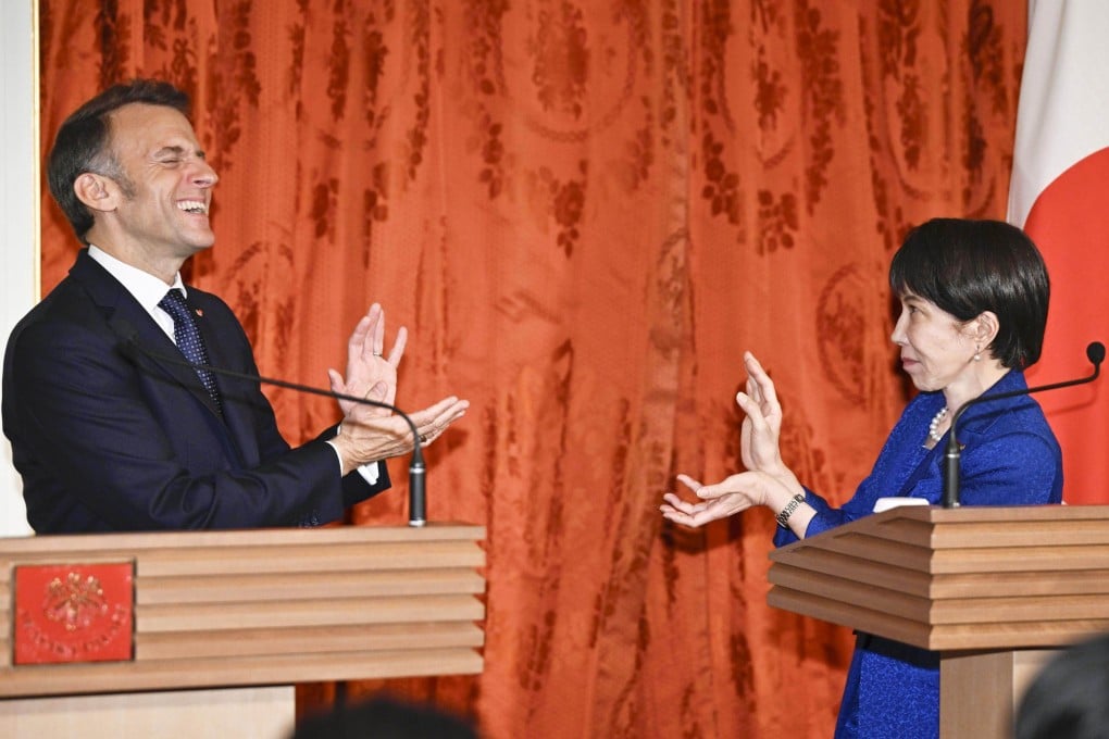 Japanese Prime Minister Sanae Takaichi (right) and French President Emmanuel Macron strike the “Kamehameha” pose from the Japanese manga Dragon Ball at the State Guest House in Tokyo on April 1. Photo: Kyodo
