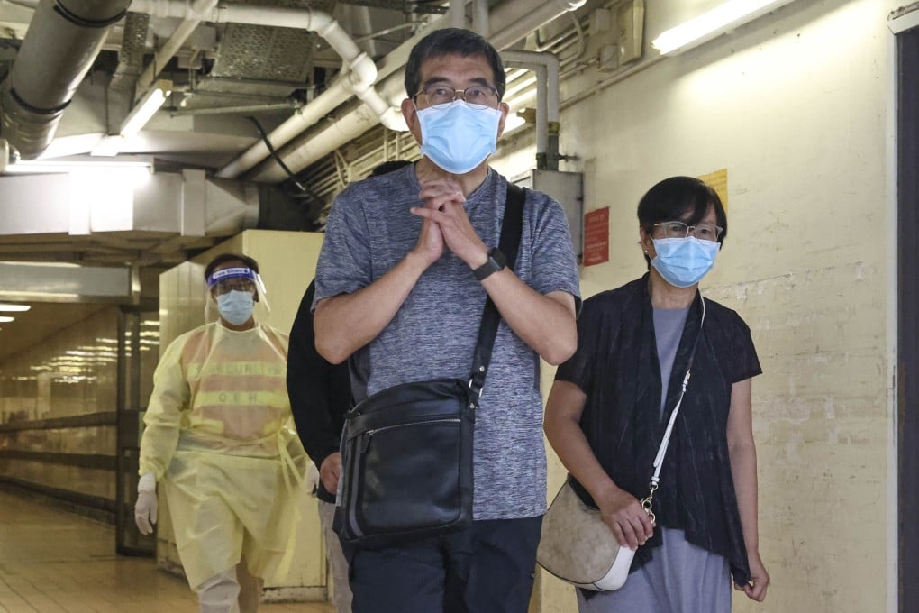 Reverend Derek Li (centre) and his wife leave Queen Elizabeth Hospital a week after their son’s accident in 2022. Photo: K. Y. Cheng