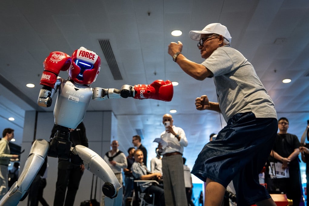 A humanoid robot squares off against a visitor during a demonstration at an exhibition in Hong Kong on April 13. Photo: AP
