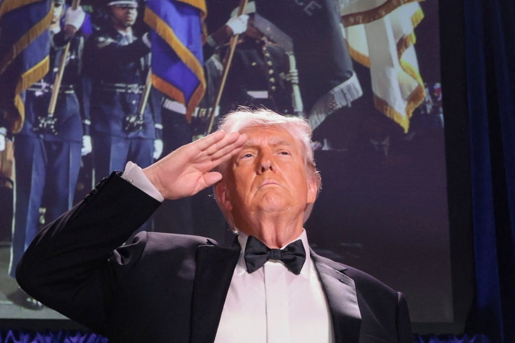 US President Donald Trump salutes during the annual White House Correspondents’ Association dinner in Washington on Saturday. Photo: Reuters