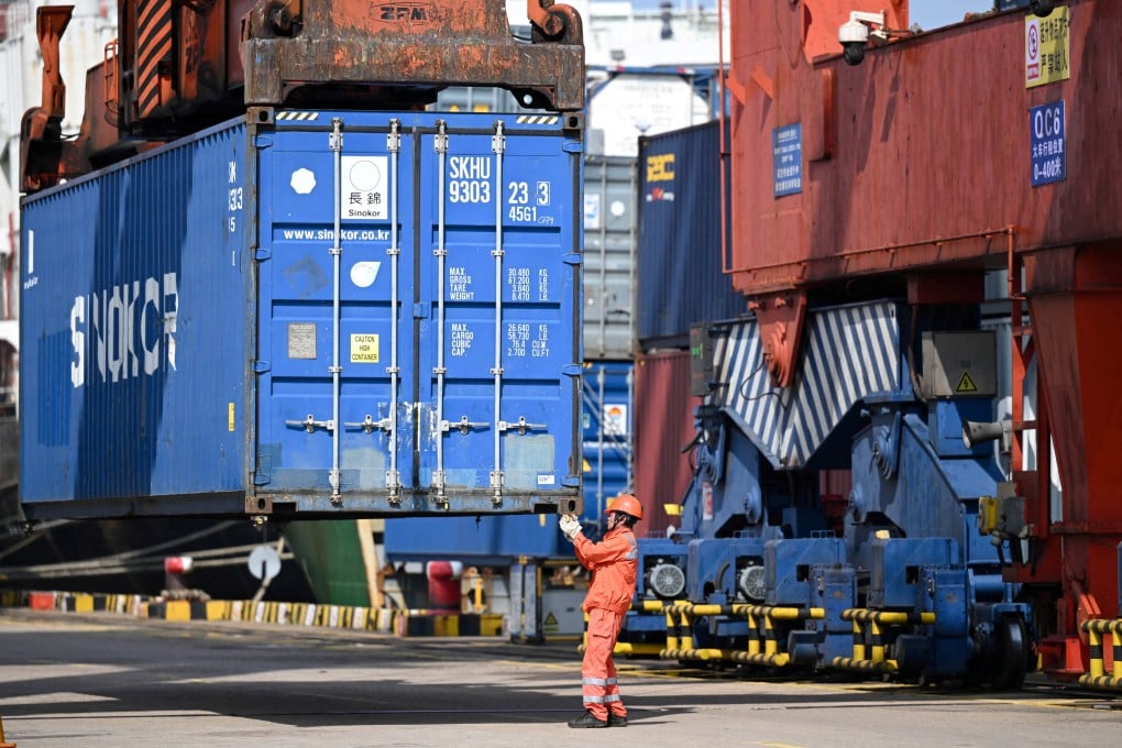 A crane lifts a container at a port this month in China’s Jiangsu province, which has been threatening to end Guangdong’s uninterrupted reign as the nation’s largest provincial economy since the late 1980s. Photo: China Daily via Reuters