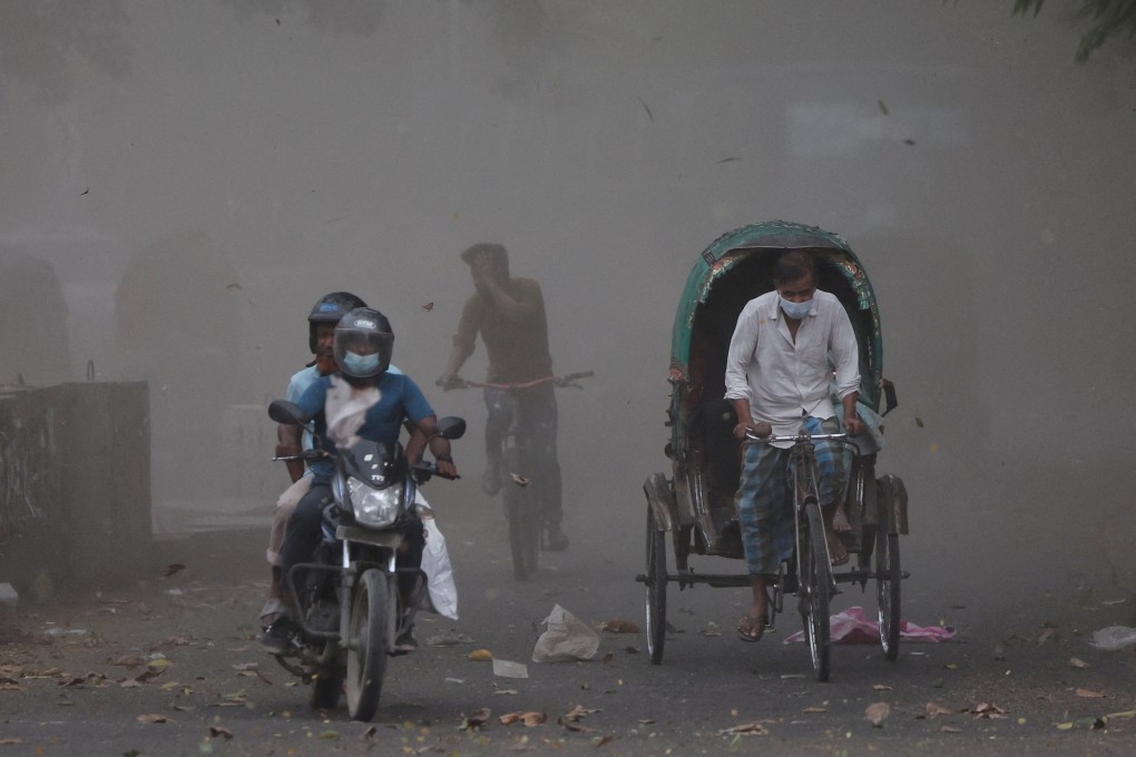 A gust of wind blows dust and leaves into the air as a storm approaches after a heat wave in Dhaka. Photo: Reuters
