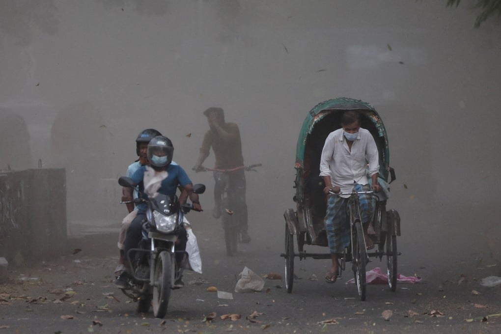 A gust of wind blows dust and leaves into the air as a storm approaches after a heat wave in Dhaka. Photo: Reuters