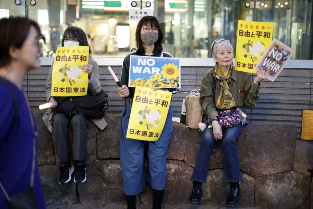 People take part in a rally against a constitutional amendment allowing Japan to sell weapons overseas, in Tokyo on April 21. Photo: EPA