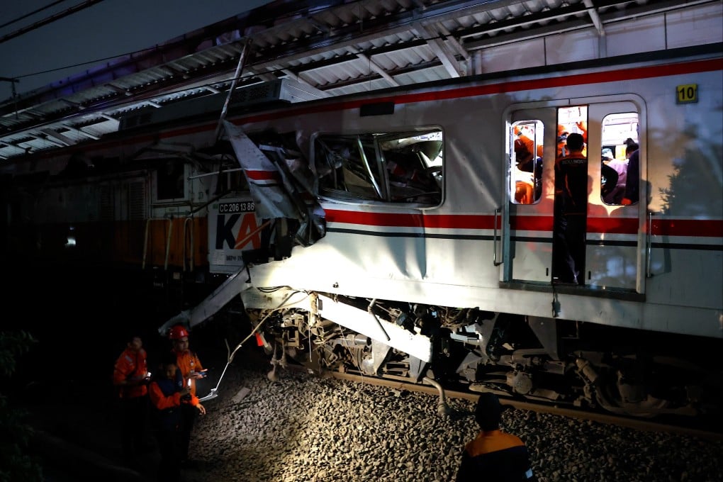Rescuers evacuate passengers from a train accident at the East Bekasi train station in Jakarta, Indonesia on Monday. Photo: EPA