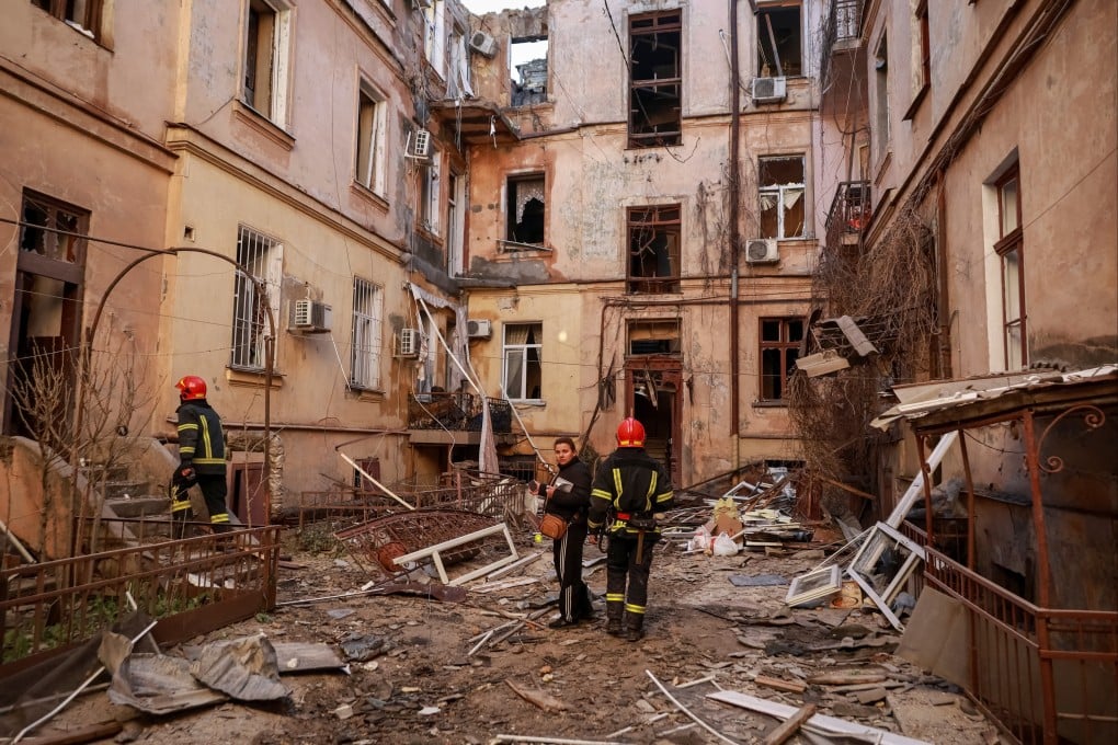 Rescuers work at apartment buildings in Odesa, Ukraine, that were hit by a Russian drone strike on Monday. Photo: Reuters
