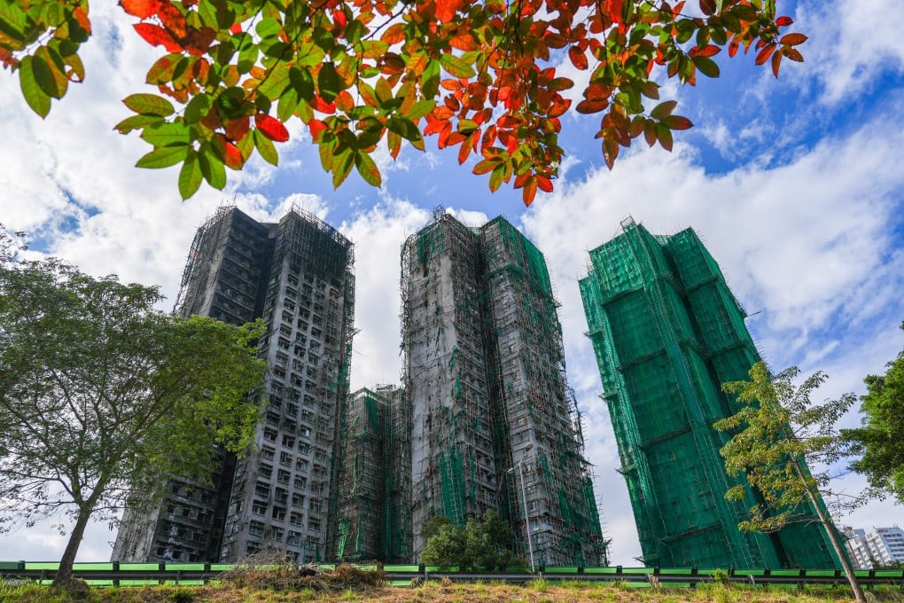 Wang Chi House (in green mesh) was originally excluded from the government’s long-term resettlement plan for Wang Fuk Court residents unveiled in February.Photo: Eugene Lee
