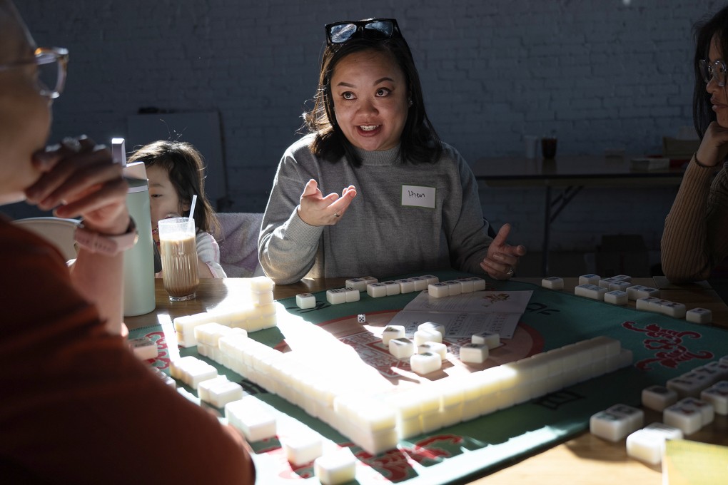 Hien Kim (centre) gives advice to the rest of her table during a monthly meeting of the Honour Tile Society mahjong club at Hot Shot Coffee in Denver, in the US. Photo: TNS