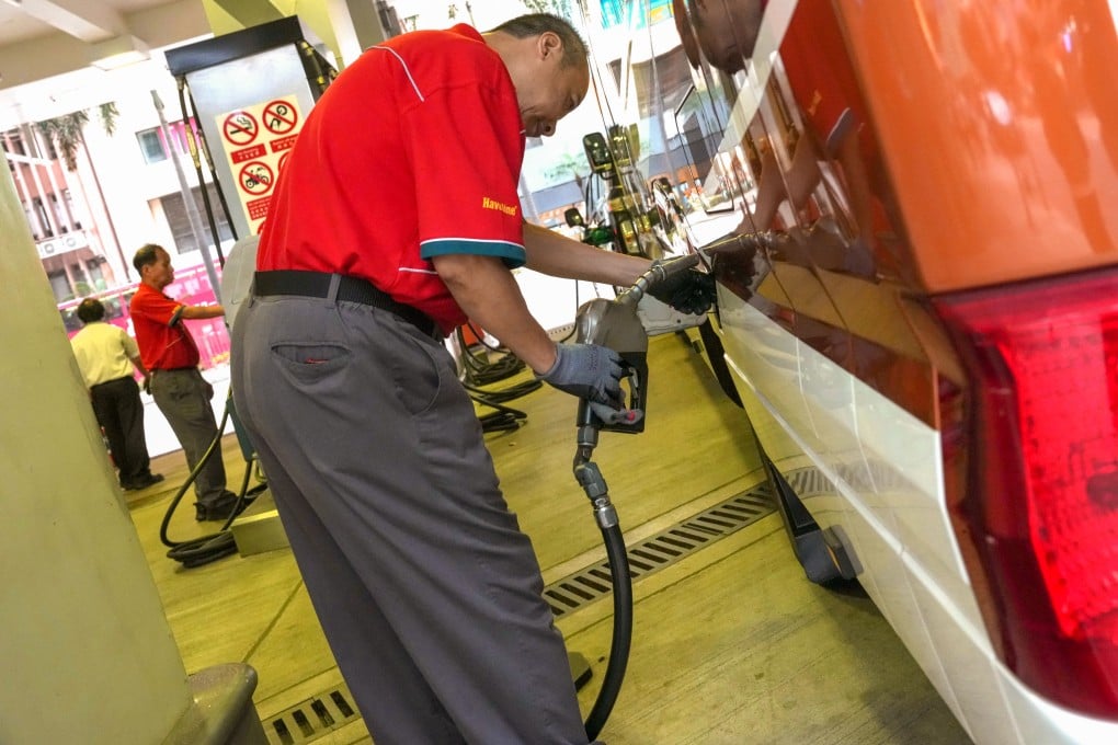 An attendant fills a vehicle’s tank at a fuel station in Wan Chai on April 10. Photo: Jelly Tse