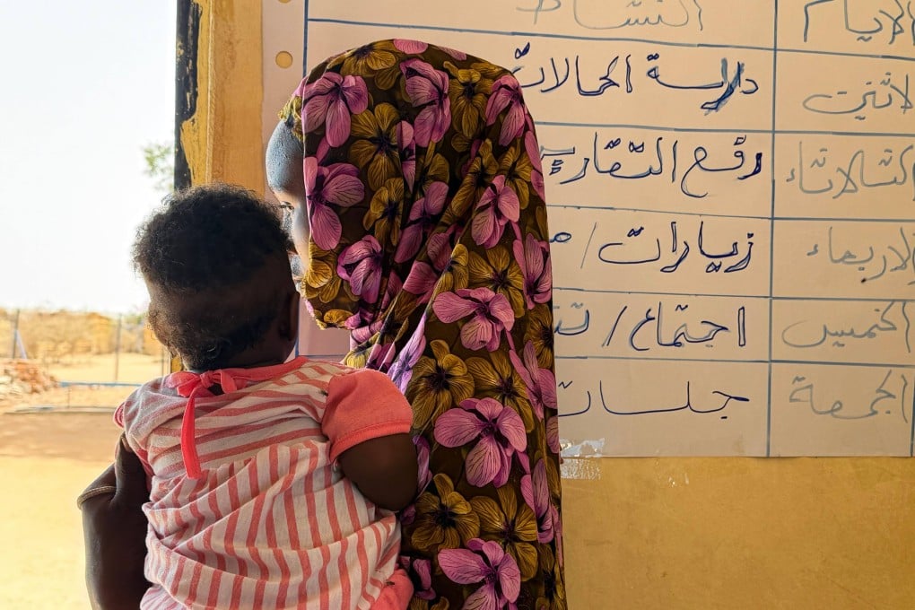 A 17-year-old from Sudan holds her child in her arms in a refugee camp in Chad. She became pregnant after being raped outside the refugee camp. Photo: dpa