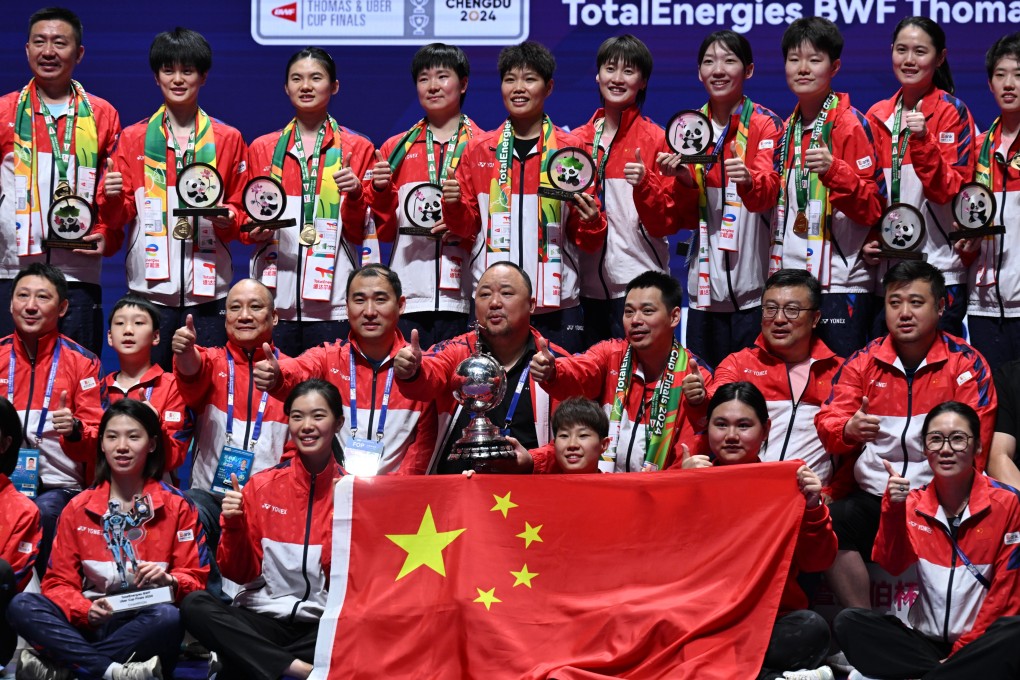 China Badminton Association president Zhang Jun (middle, with trophy) celebrates with Team China after winning the Uber Cup in May 2024. Photo: Getty Images