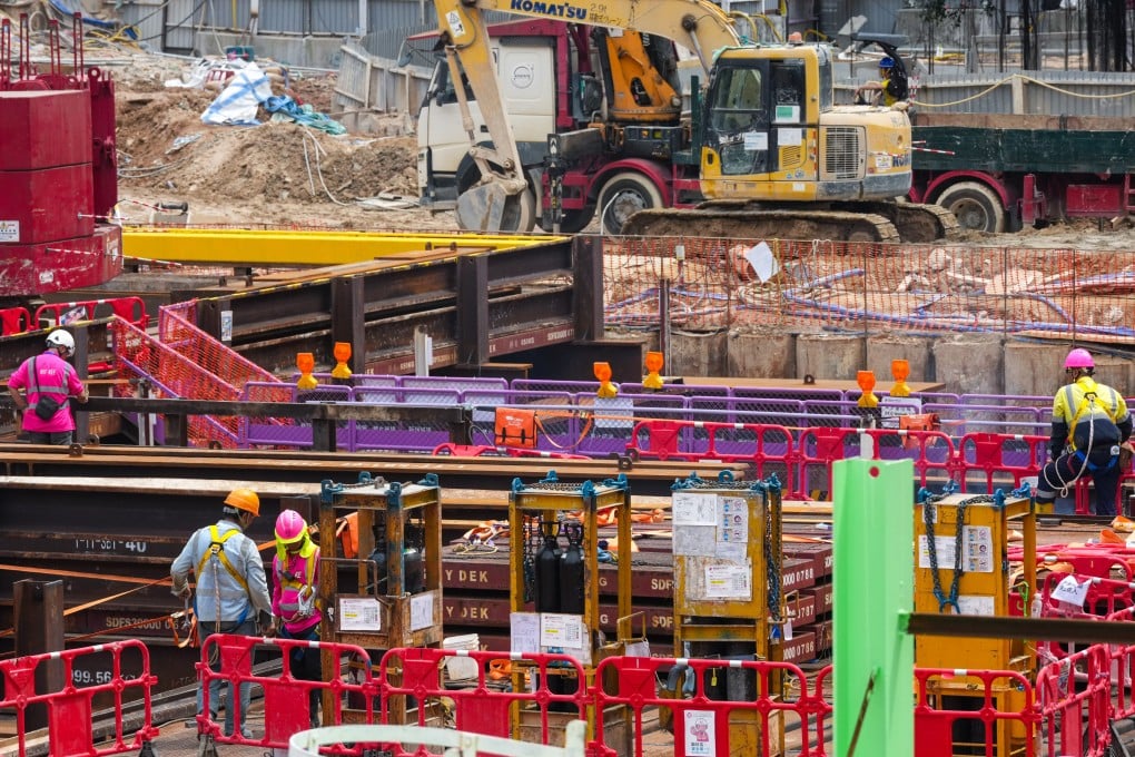 Workers are seen at a construction site in Mong Kok on March 24. Photo: Jelly Tse