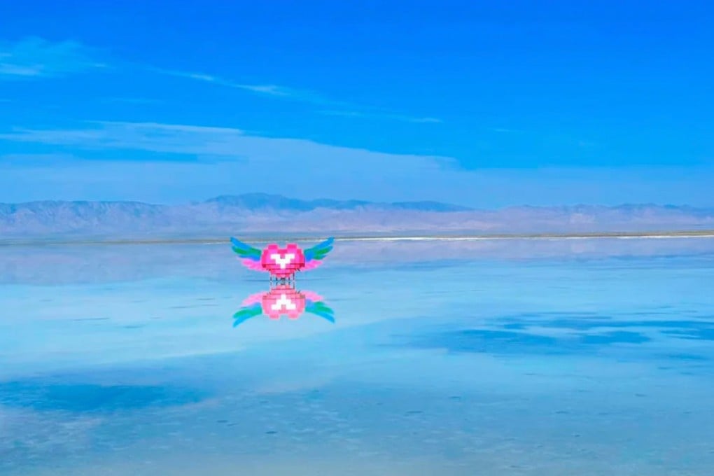 The Chaka Salt Lake in China, which is known as the “Mirror of the Sky,” features a winged heart brick sculpture that has sparked criticism for disrupting the lake’s serene beauty. Photo: RedNote