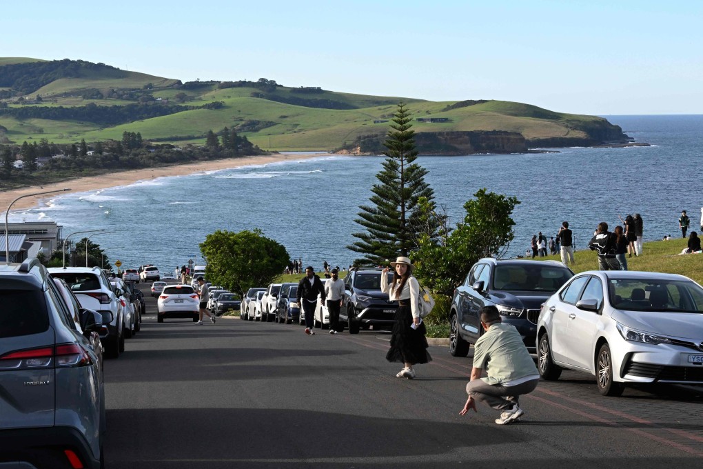 Tourists visit Australia’s “most beautiful” street in Gerringong, near Sydney, on Monday. Photo: AFP
