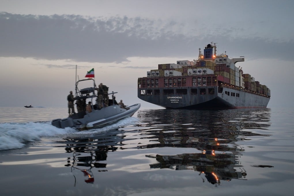 An Iranian Revolutionary Guard Navy speedboat approaches the cargo ship Epaminondas during what state media described as the seizure of one of two vessels accused of violations in the Strait of Hormuz on April 21. Photo: Tasnim News Agency via AP