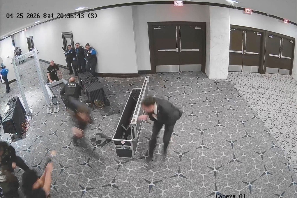 An officer fires (bottom left) as suspect Cole Tomas Allen sprints past security personnel at the Washington Hilton on Saturday. Photo: US Attorney Jeanine Pirro via Reuters