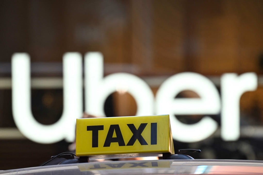 Uber says FlyTaxi will continue to operate as normal and that nothing will change for drivers and riders using either the app for Uber or the home-grown taxi-hailing service. Photo: AFP
