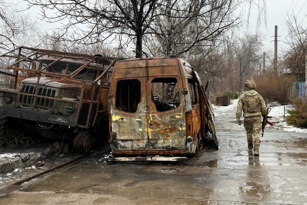 A service member of the 93rd Kholodnyi Yar Separate Mechanized Brigade of the Ukrainian Armed Forces walks on a road near destroyed cars, amid Russia’s attack on Ukraine, in the frontline town of Kostiantynivka in Donetsk region, Ukraine, on February 19. Photo: Reuters