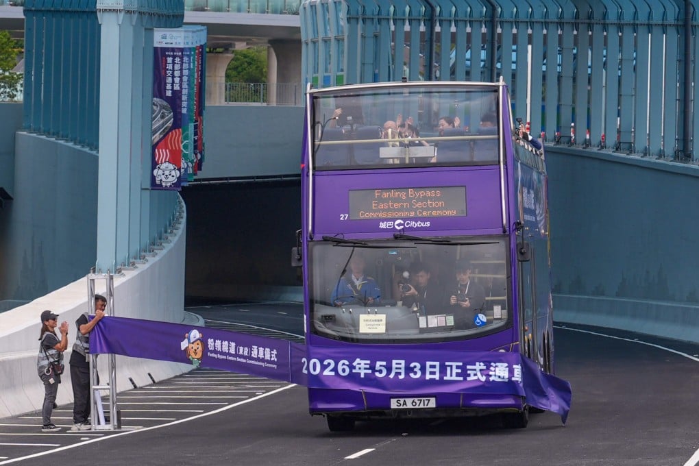 Secretary for Development Bernadette Linn and other guests ride an open-top bus through the eastern section of the Fanling Bypass. Photo: Eugene Lee