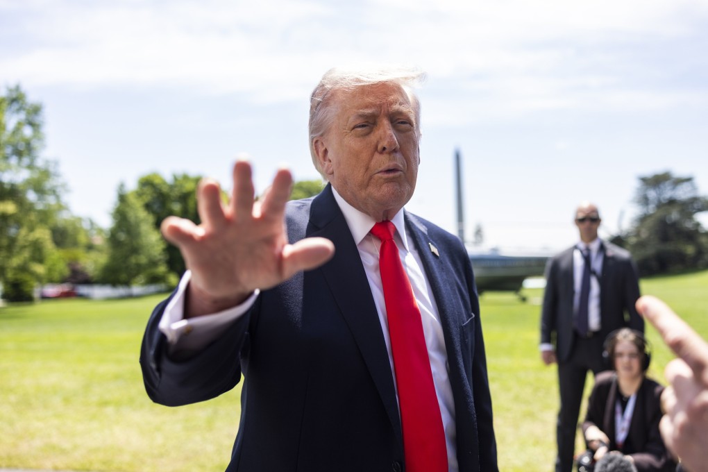 US President Donald Trump stops to speak to reporters before boarding Marine One on Friday. Photo: pool via EPA