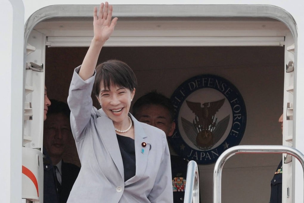 Japan’s Prime Minister Sanae Takaichi waves as she departs on an official trip to Vietnam and Australia, at Haneda Airport in Tokyo on Friday. Photo: AFP