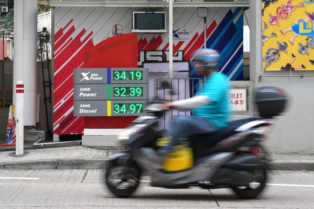A motorcycle drives past the petrol price display board outside a petrol station in Causeway Bay, Hong Kong, on April 10. Photo: Jelly Tse